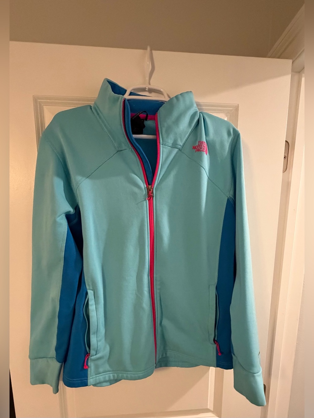 women's North Face turquoise and blue color-block jacket. Size XL